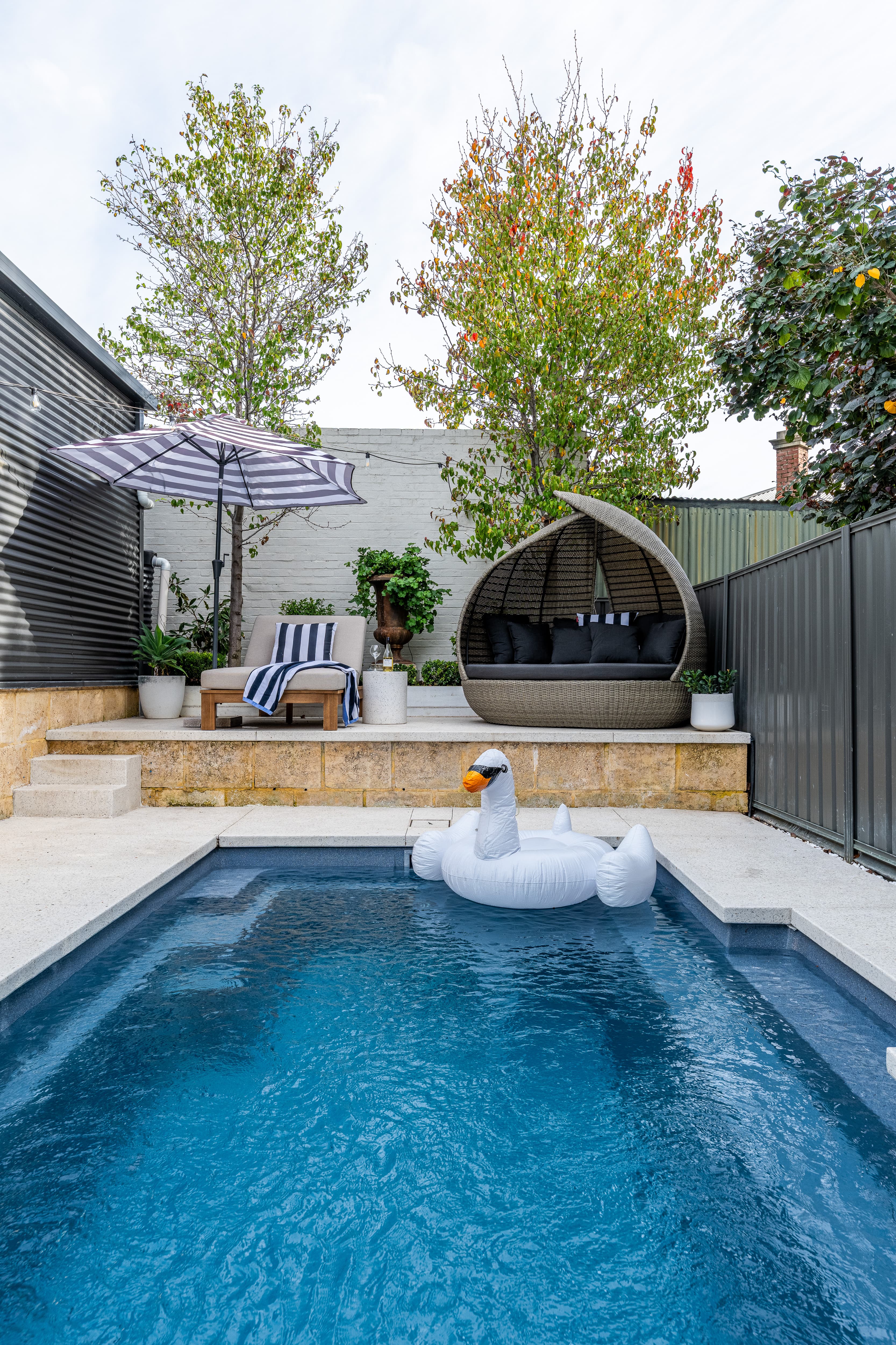 Evening lighting detail around family pool