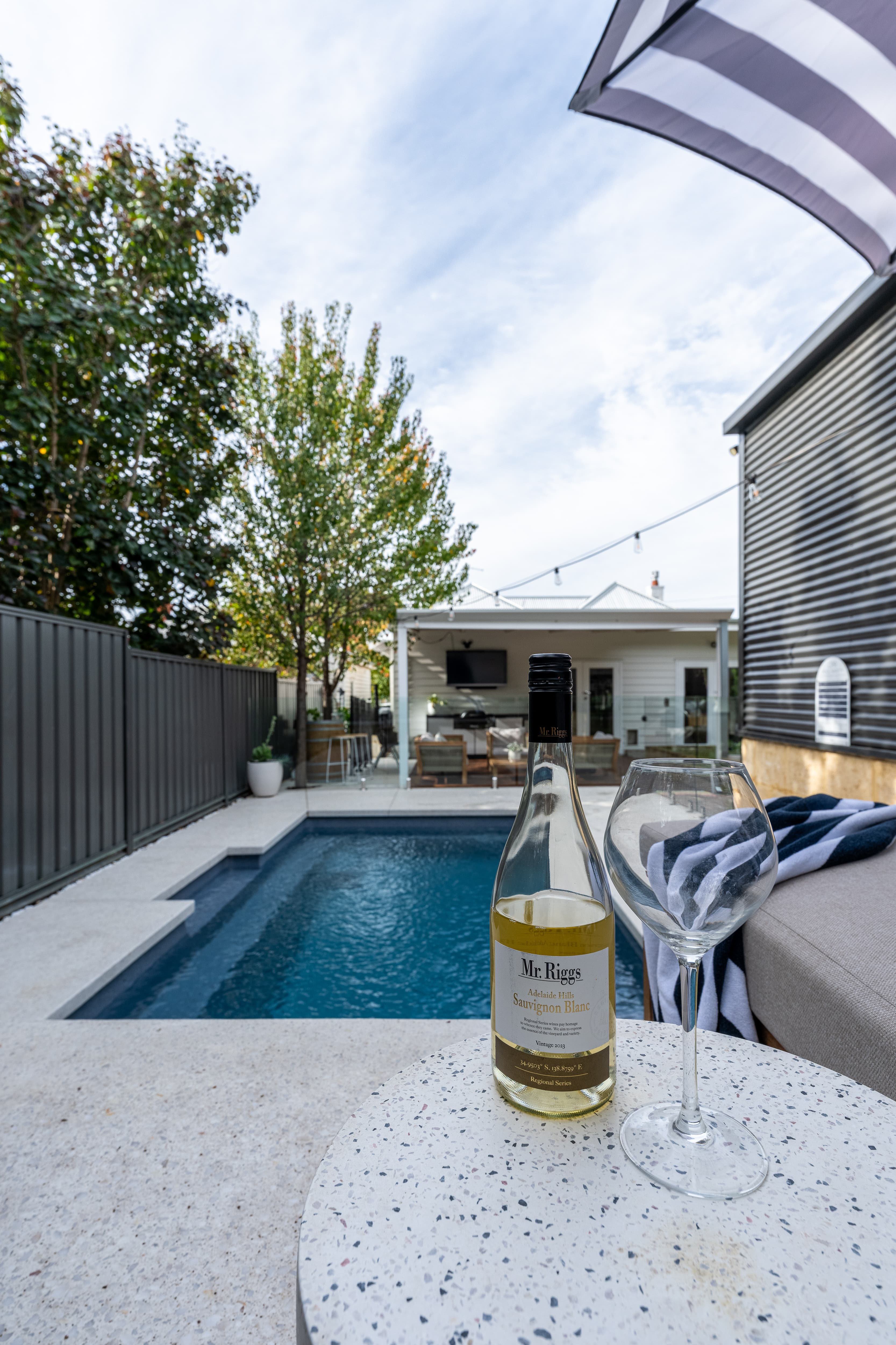 Poolside dusk scene with architectural lighting